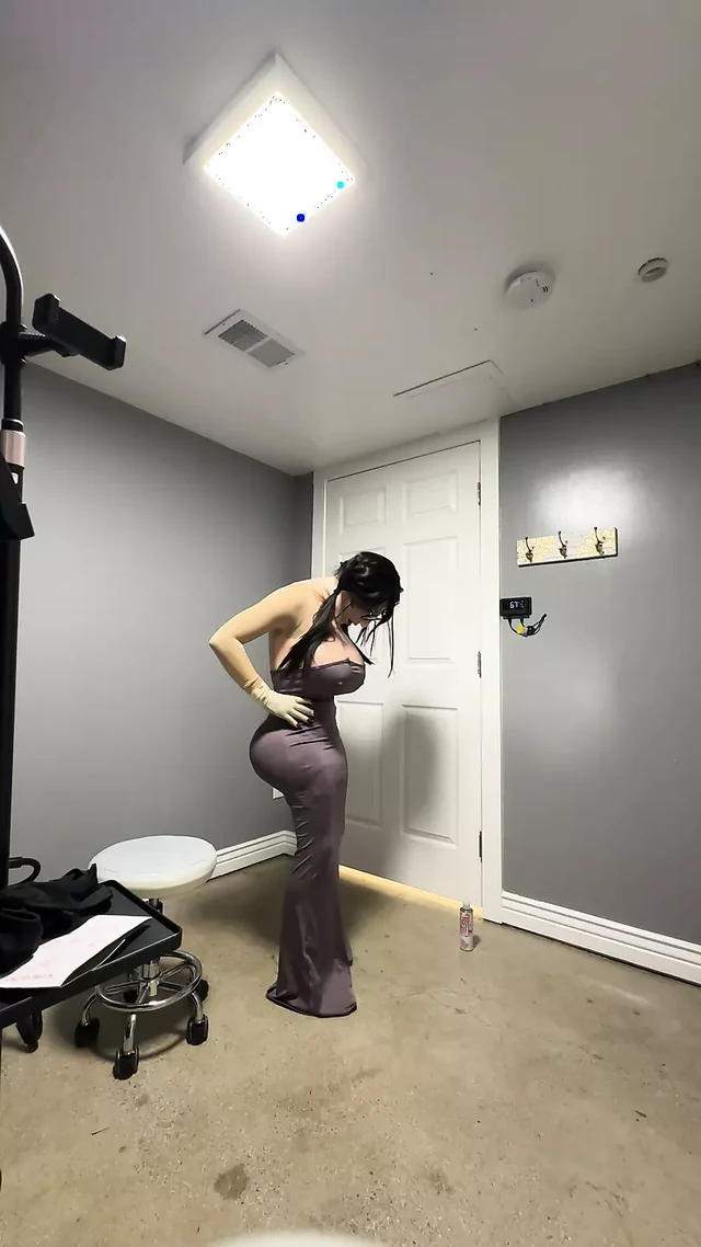 Hot trans in her sexy gray dress teasing her huge tits and ass