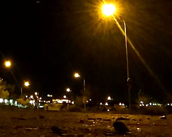 Naked on a quiet street at night