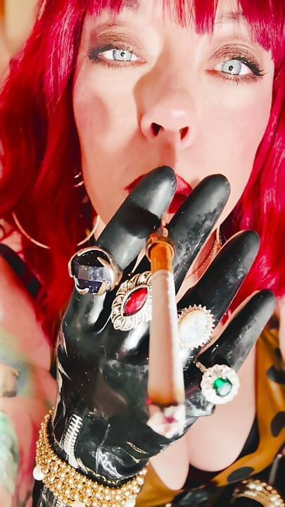 The Beautiful Rubber Beauty Tina Snua Smoking A Cigarette Using A Holder - Smoker Latex Gloves Rings Jewellery