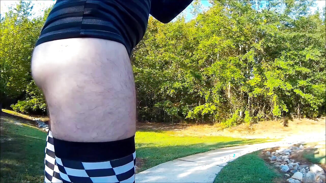 Crossdresser Walking in a public park in high heels