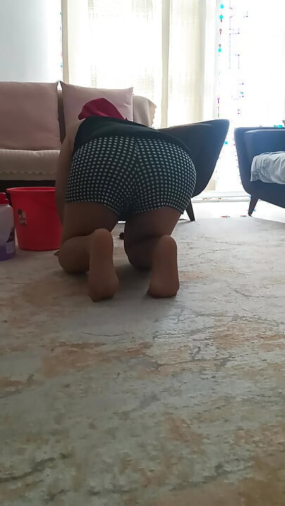 My big-buttocked, turbaned stepmother while cleaning