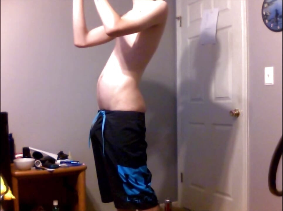 Young Guy Fills His Stomach with Water