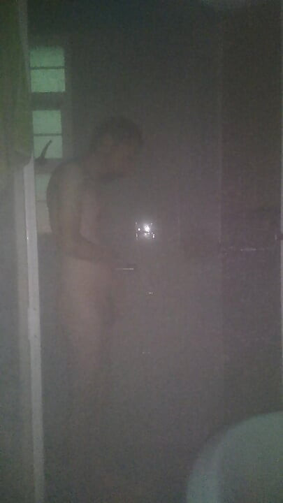 Man Showering with Flashlight On