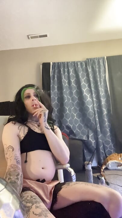 Sexy crossdresser smokes