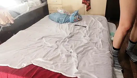 Sexy brunette doing naked chores around the house.