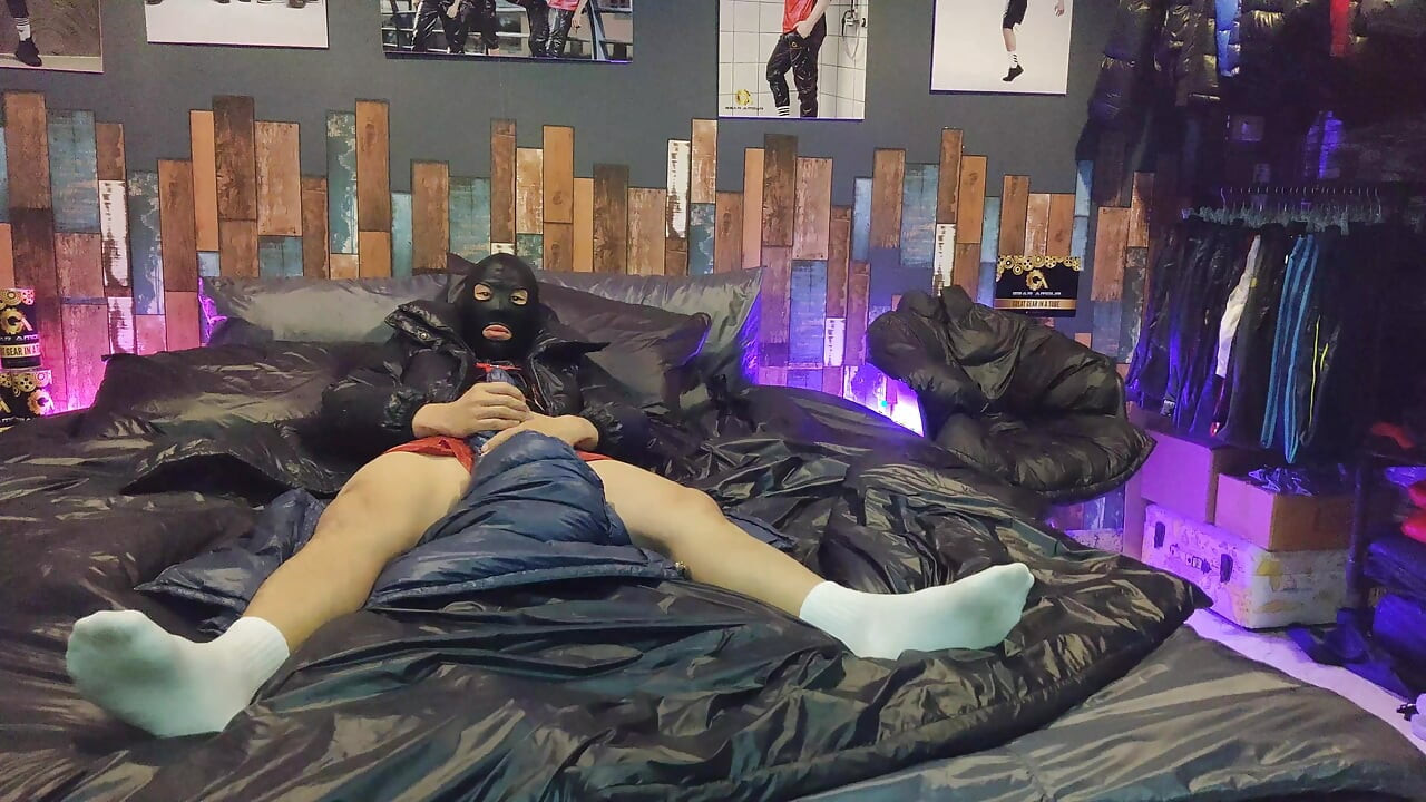 Cock Rubbing Down Jacket on Shiny Nylon Bed
