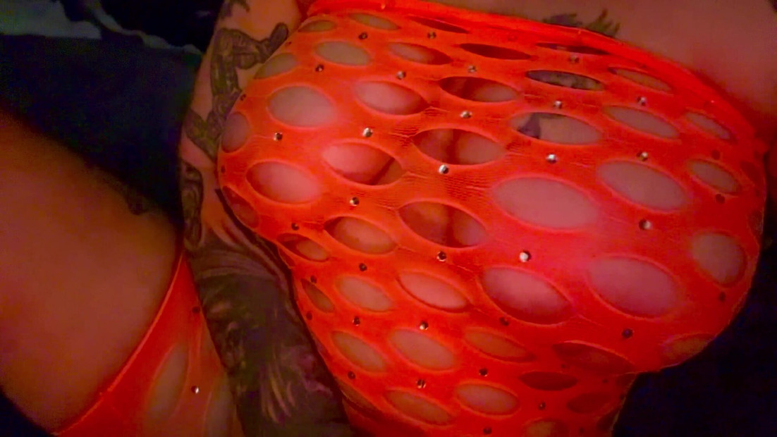 Fishnet dress teasing with tits