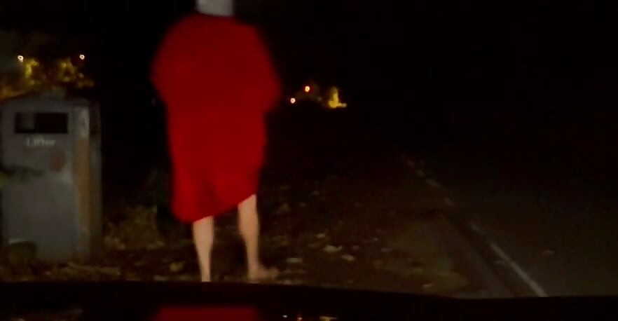 Interrupted while cutting off clothes , had to hide infront of car crouched down till car passed
