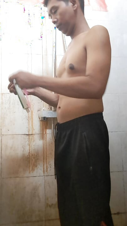 Exotic skinned adult man taking a bath in the afternoon