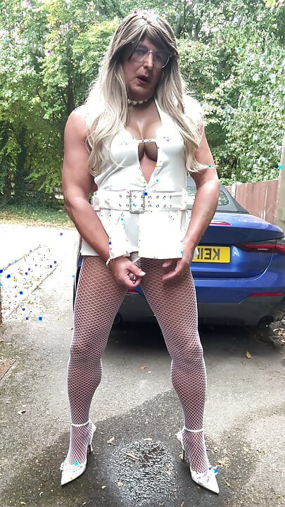 Sexy Crossdresser kellycd2022 in sexy white mini dress and fishnet pantyhose and heels