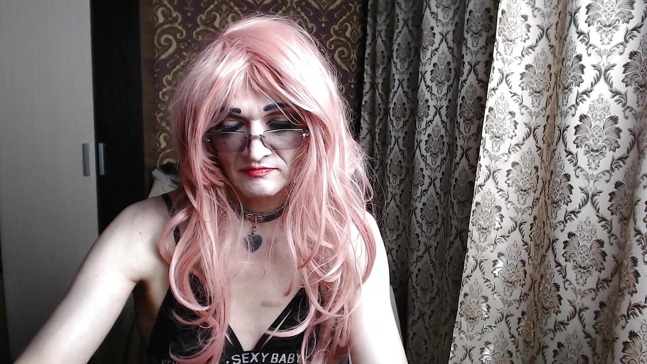 A Transvestite, a Slutty Girl in a Maid's Dress, Records Herself on Webcam