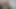 Tütünden yapılmış bir sigara içiyor