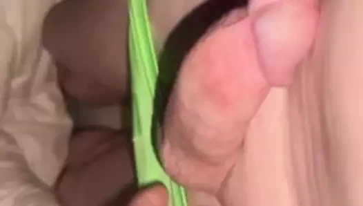 Green undies with a smooth circumcised cock hiding inside
