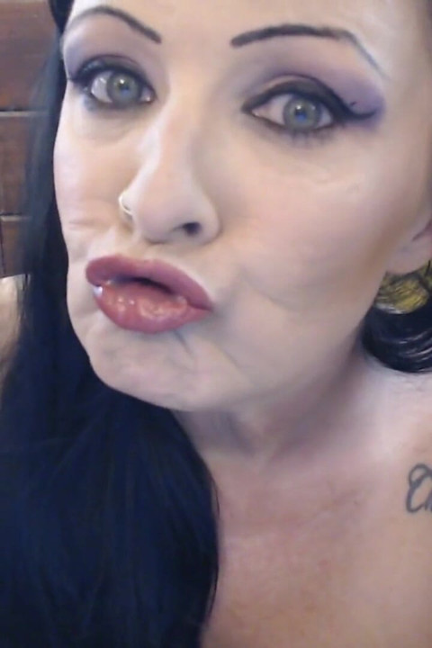 Crimson red duck lips puckered