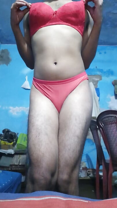 Young sissy crossdresser in her step sister's red bra and thong panties