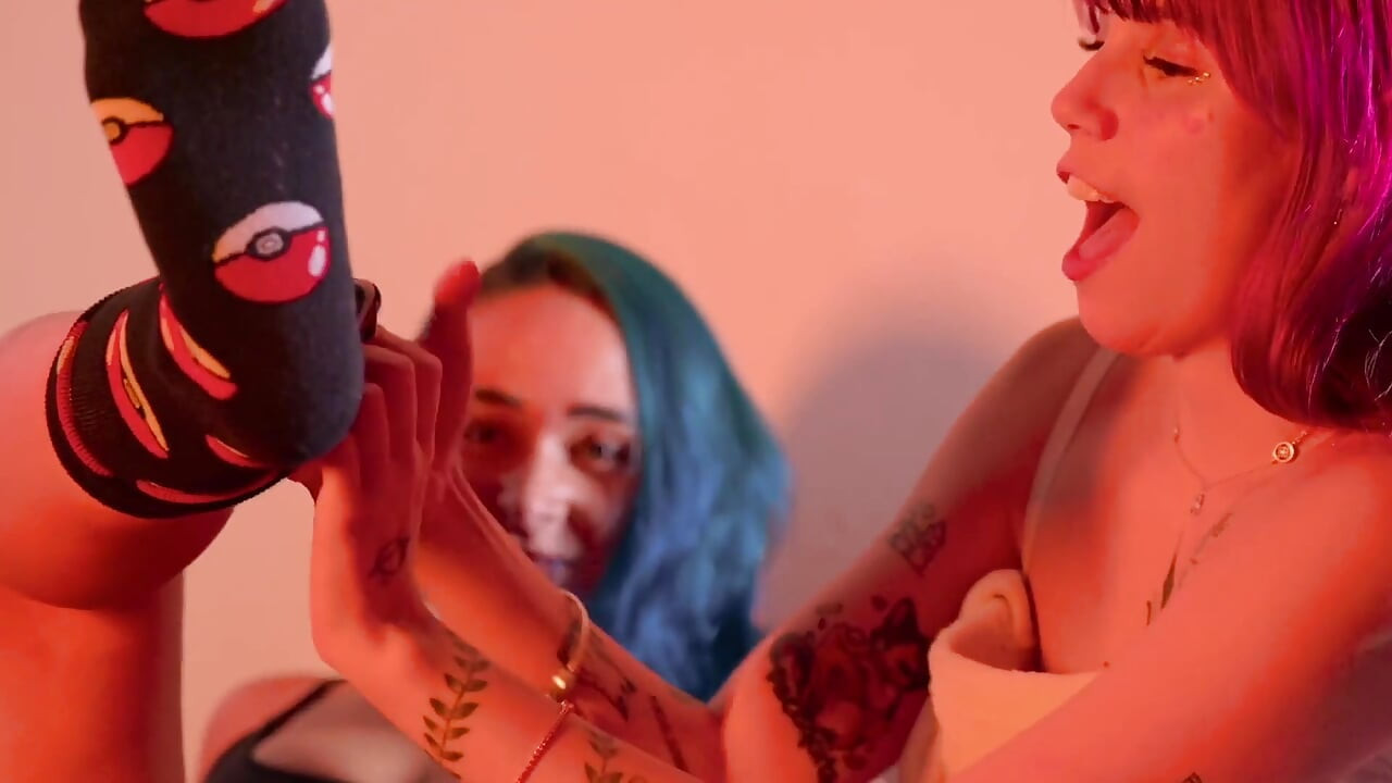 Two Girls Rubbing and Licking Their Feet Intensely