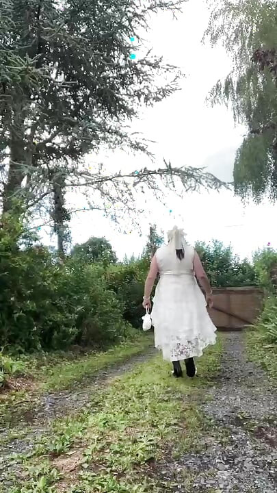 In an outfit with a long white dress for an evening.