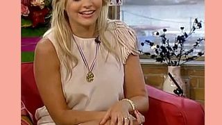 HOLLY WILLOUGHBY FLASHING SOME THIGH