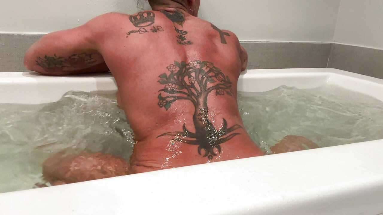 Muscle Goddess Fucks Her Big Clit with the Shower Nozzle