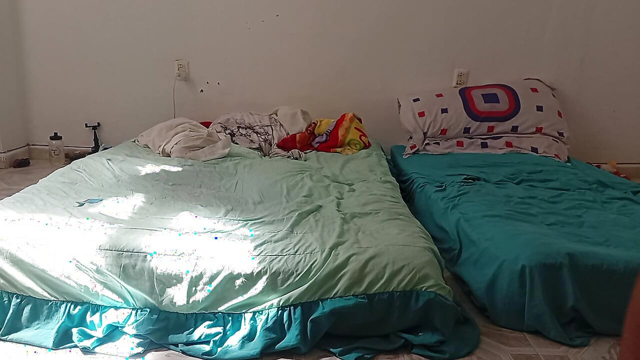 Mexican mother-in-law cleaning guest room in thong