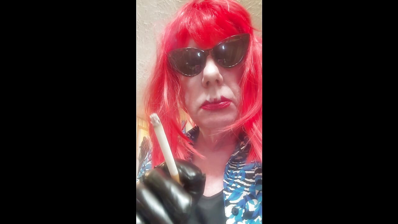 MRS. ROMAN DESTROYING A MARLBORO 100 MENTHOL CLOSE UP - WITH DANGLING AND NOSTRIL EXHALES