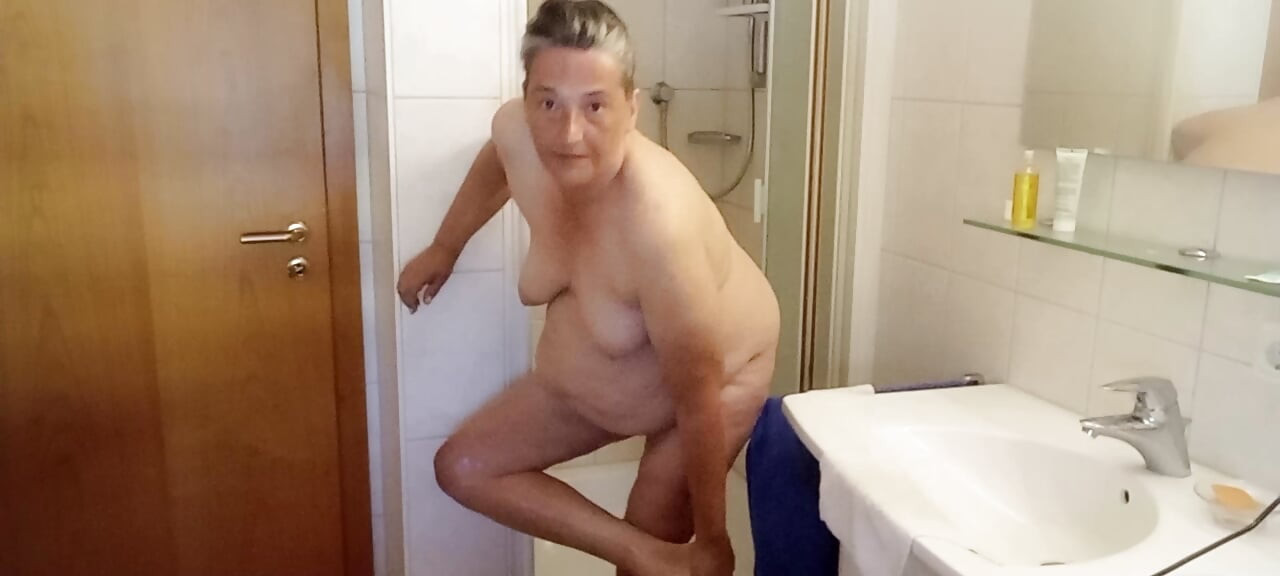 German BBW MILF 53 oils her soft fat body after showering