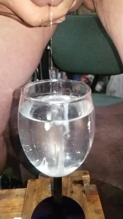 Slo-mo cum in glass of water