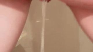 Girlfriend piss on stand at the bathroom