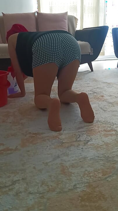 My big-buttocked, turbaned stepmother while cleaning