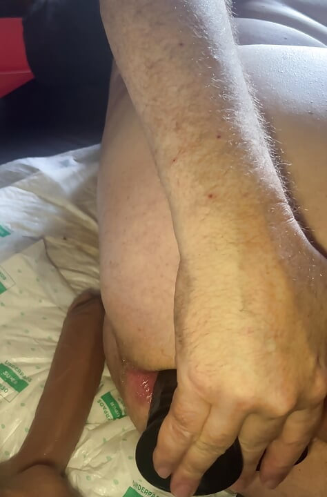 Grandpa puts on a side dildo and touches his cock at the same time