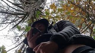 Muscular guy bodybuilder is jerking off in forest outdoor