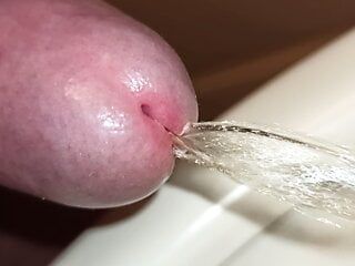 Extreme close-up of uncut cock, pissing!