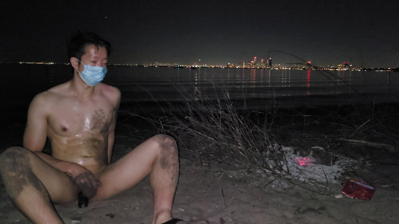 oiled masturbating and piss on the nude beach at night