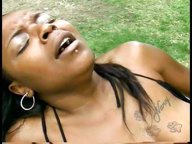 Thick black slut lifts legs to get her wet pussy licked by a chick