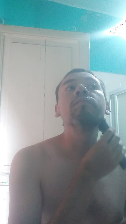 Man washes his face