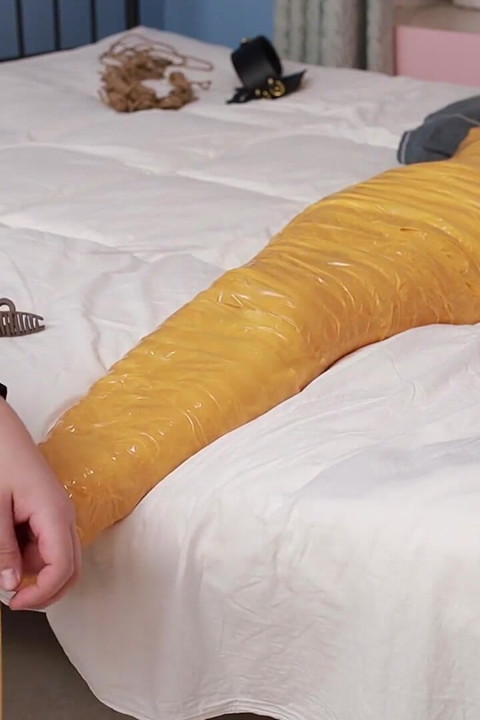A Cute Barefoot Girlfriend Uses Tape to Bind Her Whole Body, Playing with Her Cute Bare Feet