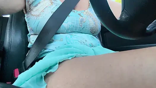 An elegant lady drives to work and rubs her pussy with her hand between her hot thighs