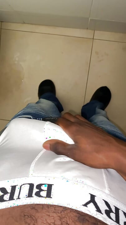 Thug beating his meat in the office