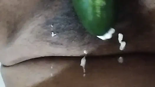 Busty bitch playing with herself and fucking herself with a cucumber
