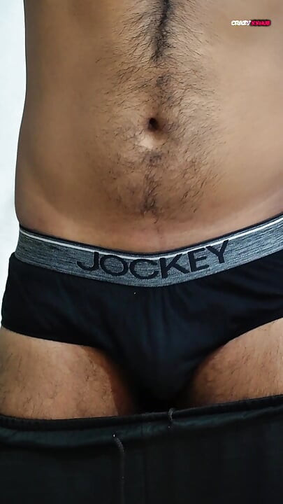 A sexy guy is dancing while holding his cock.
