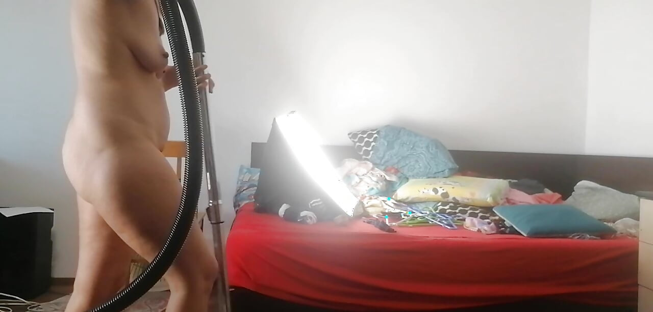 Amateur wife vacuuming in the bedroom. Sexy naked wife preparing food in the kitchen.