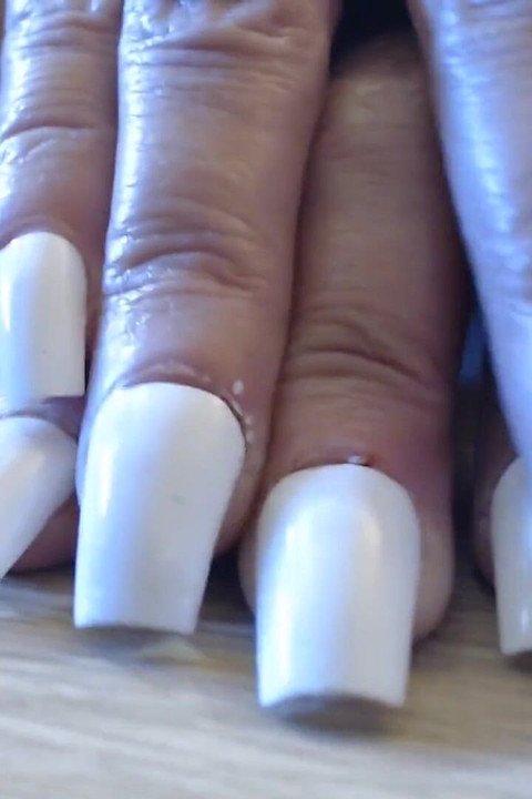 Tapping clicking white fingernails