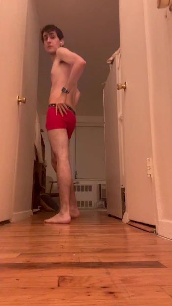 young man stripping and showing off