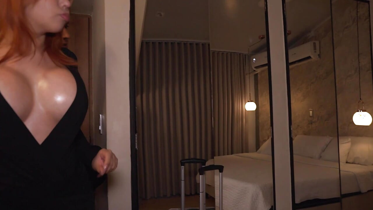 A busty redhead has no choice but to share the same hotel bed with her roommate.
