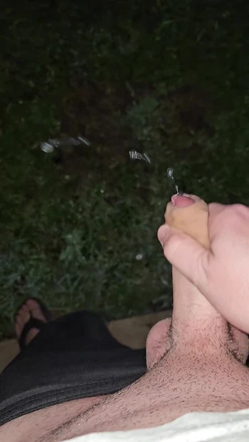 Cumshot outdoors at night