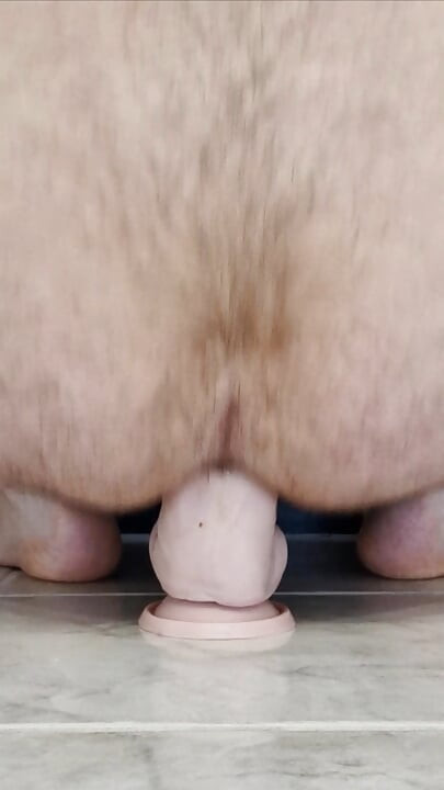 Fucking a thick dildo doggy