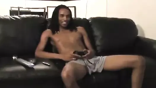 Horny black twink masturbating on the couch