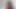English chick with piercing smiles as she strokes a dick