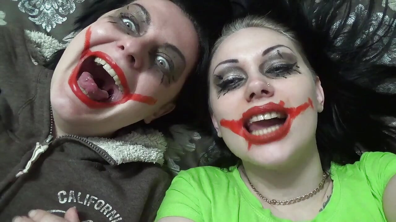 Two crazy clown girls dangle you above their hungry mouths before fighting over who will eat you alive