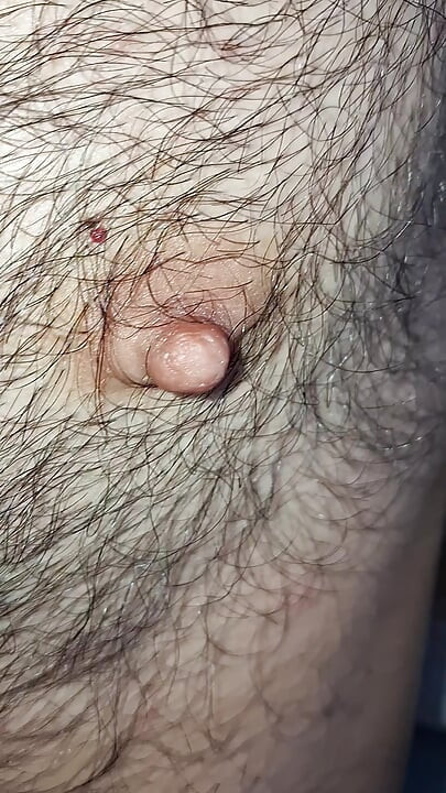 Male nipples in the foreground